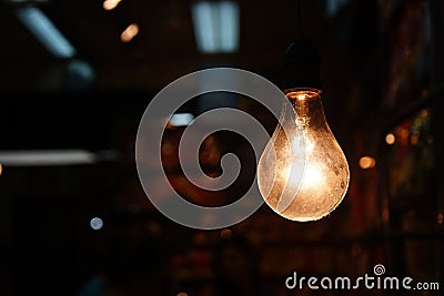 Warm tone old style hanging light bulb decoration Stock Photo