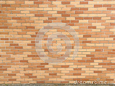Warm-toned brick wall with light gray mortar Stock Photo