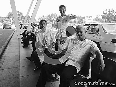 Warm welcome taxi cab drivers at Borneo Airport who happily posed for photo Editorial Stock Photo