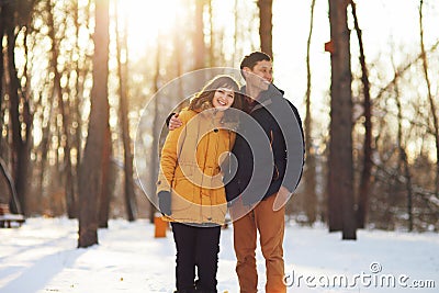 Warm winter portrait of a couple of different race in the forest Stock Photo