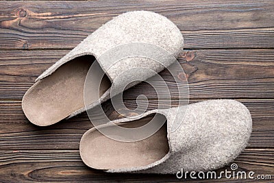 Warm winter women woolen slippers on the floor. Copy space for text Stock Photo
