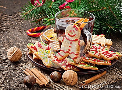 Warming mulled wine, spices and gingerbread cookie Stock Photo