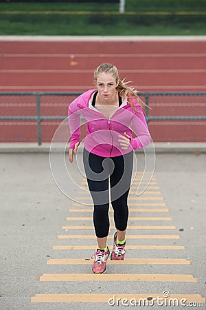 Warming up in pink jacket Stock Photo
