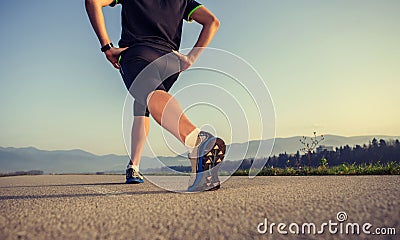 Warming up runner on the road close up image Stock Photo