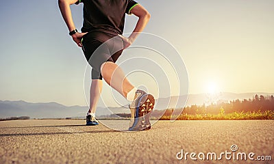 Warming up runner on the road close up image Stock Photo