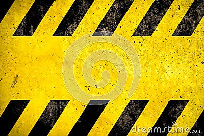 Warning background danger caution yellow black stripes painted over yellow concrete wall texture empty space text message Stock Photo