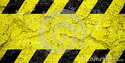 Warning danger sign yellow and black stripes pattern with yellow area over concrete cement wall facade peeling cracked paint Stock Photo