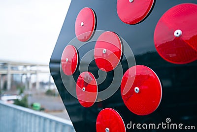 Warning road arrow sign with red reflectors Stock Photo