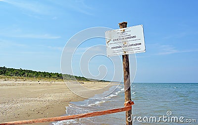 Warning Sign on the beach of the nature reserve at the mouth of the river Bevano Stock Photo