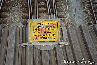 Warning sign Caution high voltage in german Stock Photo