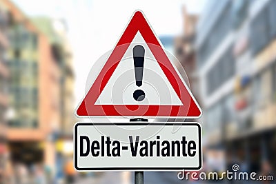 Warning sign in city sky and german word for covid-19 delta variant Stock Photo