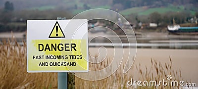 Warning sign - Danger - tides and quicksand, United Kingdom Stock Photo