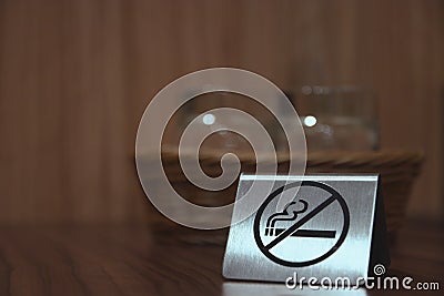 Warning sign. no smoking on the table in the room. Iron plate on the table does not smoke close-up. horizontal view Stock Photo