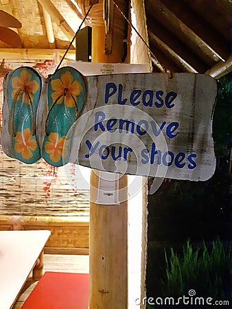 warning sign for removing sandals Stock Photo