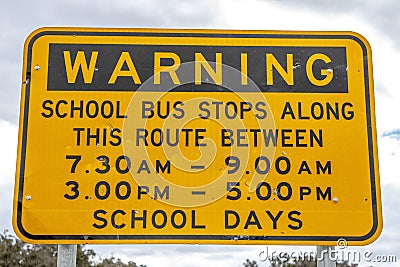 Warning sign about school bus stops along this route at Emmaville, New South Wales, Australia. Stock Photo