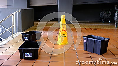 Warning sign of slipery floor when wet at public space. Editorial Stock Photo