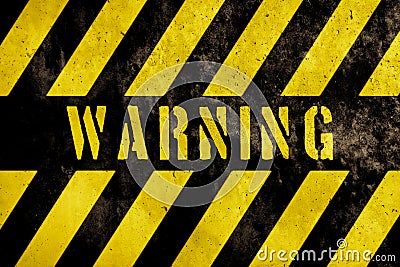 Warning danger sign text with yellow and dark stripes painted over concrete wall facade texture background. Stock Photo