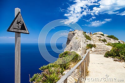 Warning sign at vantage point with view Mirador Es Colomer on punta nau at cap formentor majorca mallorca. Balearic islands Stock Photo