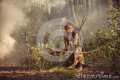 Fantasy medieval woman hunting in mystery forest Stock Photo