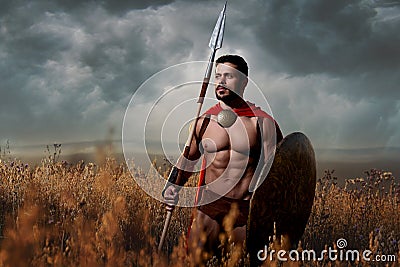 Warrior with sword and shield going in attack. Stock Photo