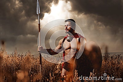 Warrior with sword and shield going in attack. Stock Photo