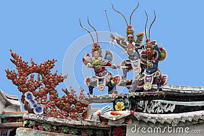 Warriors on a temple roof Stock Photo