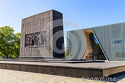 Warsaw Ghetto Heroes monument by Albert Speer in front of POLIN Museum of the History of Polish Jews in historic Jewish ghetto Editorial Stock Photo