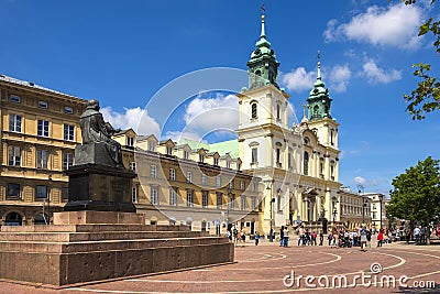 Warsaw, Poland - Front view of the baroque Holy Cross Church and the Mikolaj Kopernik statue, at the Krakowskie Przedmiescie Editorial Stock Photo