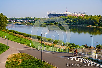 Warsaw, Mazovia, Poland - Panoramic view of the PGE Narodowy national stadium across the Vistula river seen from Solec district Editorial Stock Photo