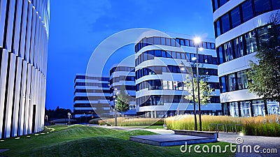 Business Garden complex in night. Seven independent buildings characterized by original architecture and an internal green garden. Editorial Stock Photo