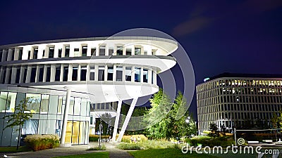 Business Garden complex in night. Seven independent buildings characterized by original architecture and an internal green garden. Editorial Stock Photo