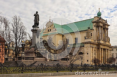 Warsaw, Poland - February 27 2019: Adam Mickiewicz monument and Church of Saint Joseph at the center of the city Editorial Stock Photo