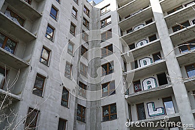 Unfinished residential building covered with graffiti - abandoned real estate project Editorial Stock Photo