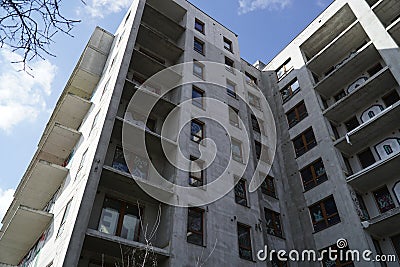 Unfinished residential building covered with graffiti - abandoned real estate project Editorial Stock Photo