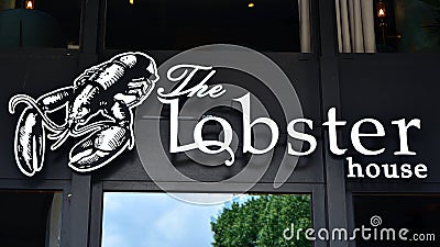 Sign The Lobster House. Company signboard The Lobster House. Editorial Stock Photo