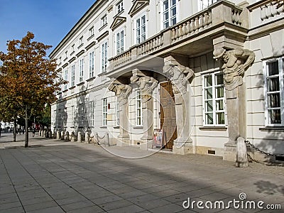 Atlantes on facade of Tyszkiewiczâ€“Potocki Palace at west entrance on Krakowskie Przedmiescie in Warsaw Editorial Stock Photo