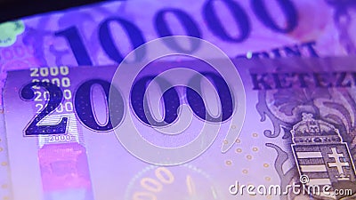 Warsaw, Poland 01.01.2021 Polish Zloty banknote under the UV counterfeit testing Stock Photo