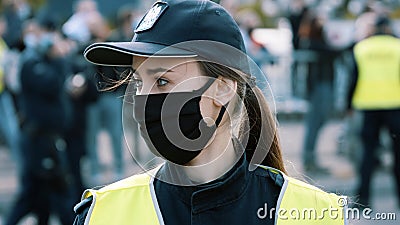 Warsaw, Poland, 05.07.2020 - Protest of the Entrepreneurs. Portrait of the young woman, polish police officer on Editorial Stock Photo