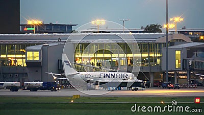 WARSAW, POLAND - SEPTEMBER 14, 2017. Finnair Oyj commercial airplane boarding at the international Chopin airport Editorial Stock Photo