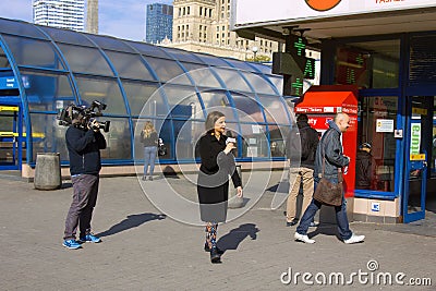 job of a reporter on street. interview people on camera TV Editorial Stock Photo