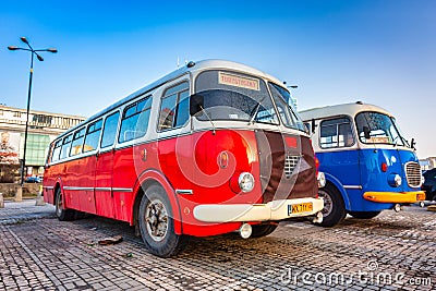 Warszawa, Poland - February 25, 2021: Vintage trip buses parked under the Palace of the Culture and Science in Warsaw city center Editorial Stock Photo