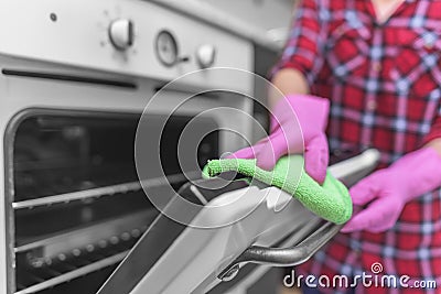 Wash the oven door. Stock Photo
