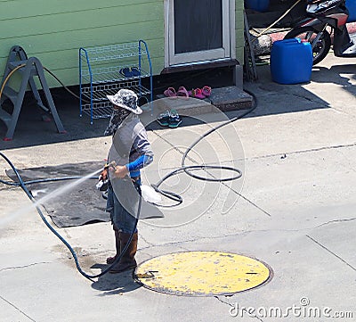 Washing car by worker who standing outdoor. Stock Photo