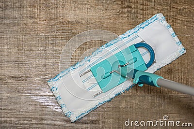 Washing and disinfection of floors, wet cleaning of the house. Cleaning a vinyl brown floor with a mop. House cleaning Stock Photo