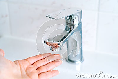 Washing hands person for coronavirus prevention, hygiene to stop spreading covid-19 in bathroom. Washing hands under Stock Photo