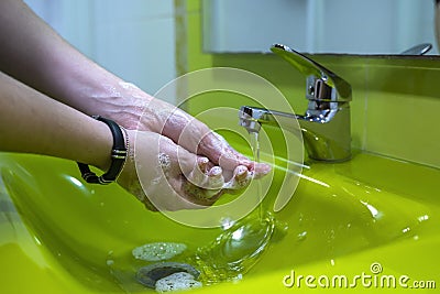 Washing hands properly. Hygiene concept. Rubbing with soap and water. Colorful sink Stock Photo