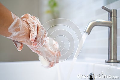 Washing hands with soap and water. Women scrub hand soap with wash basin .The concept of hand hygiene and hand washing days around Stock Photo