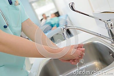 Washing hands to prevent infection Stock Photo