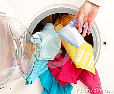 Washing machine with colorful clothes Stock Photo