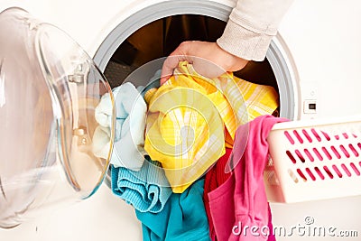 Washing machine with colorful clothes Stock Photo